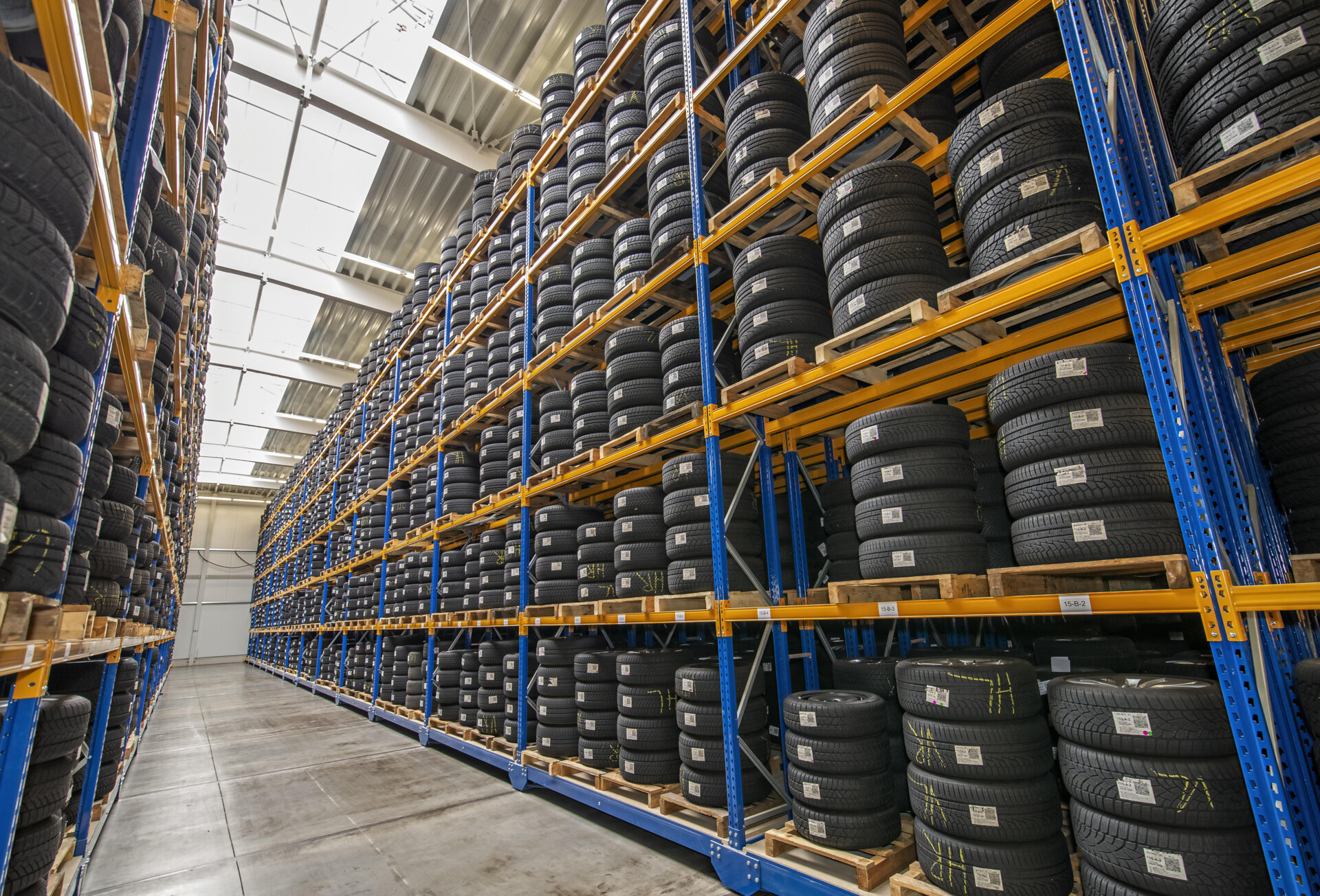 High rack with customer tires in warehouse of a tire dealer