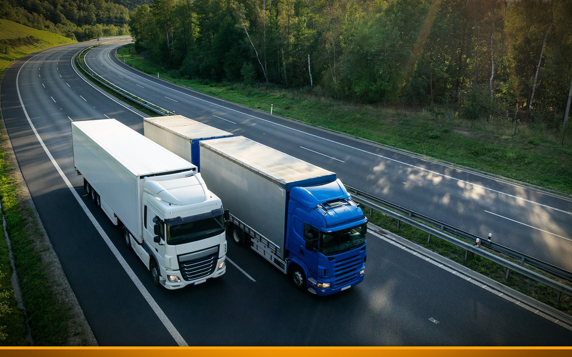 Trucks overtake each other on the highway