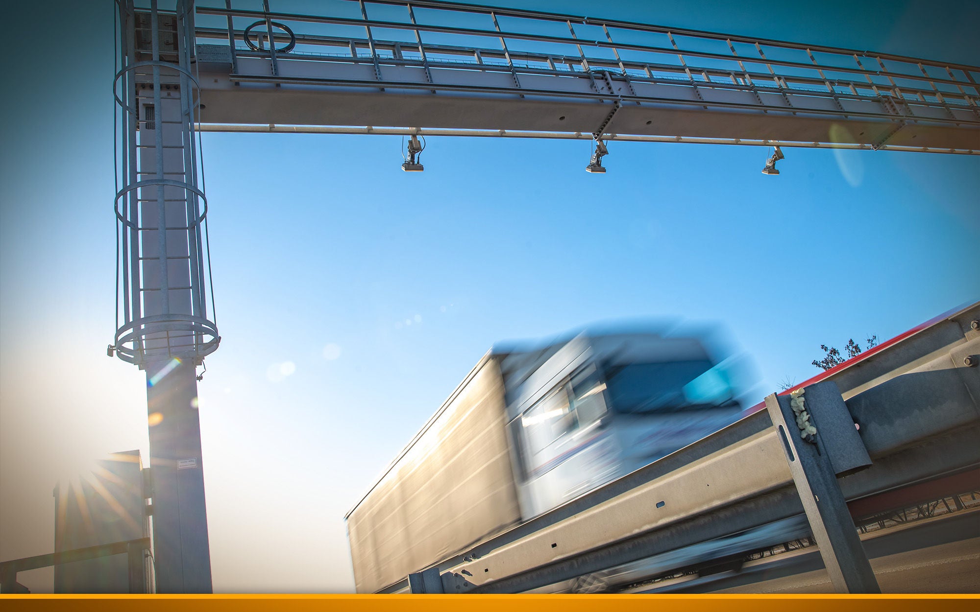 truck passing through a toll gate on a highway toll roads