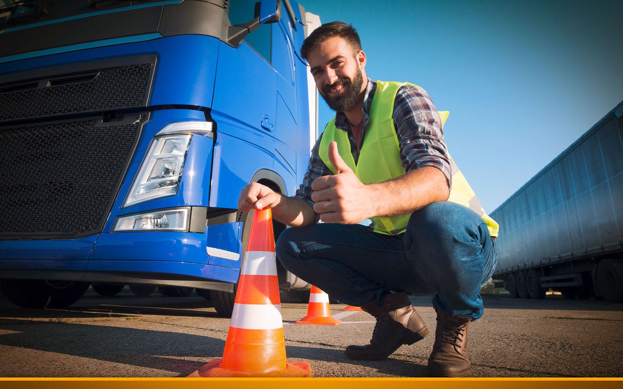 Trucker in front of his truck