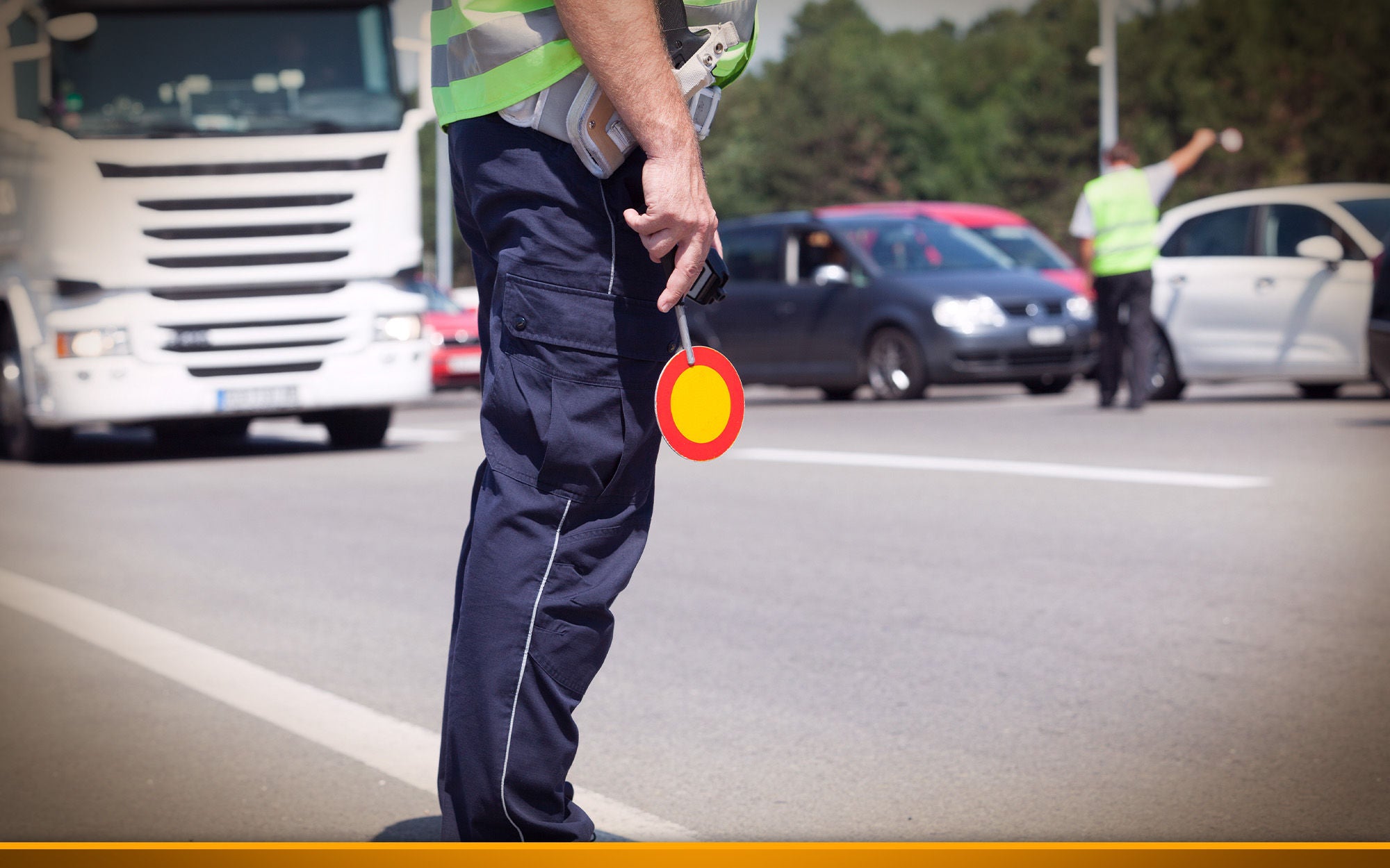 Police officer controlling traffic on the highway