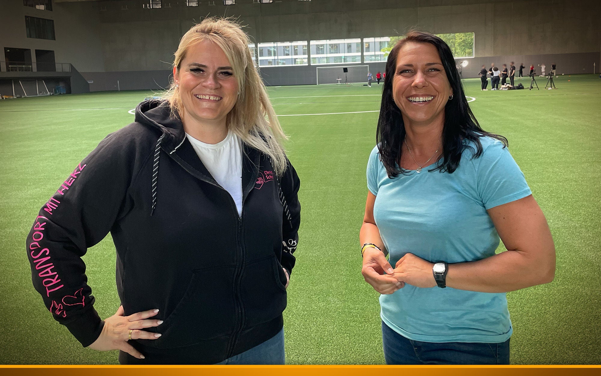  two women on a soccer field