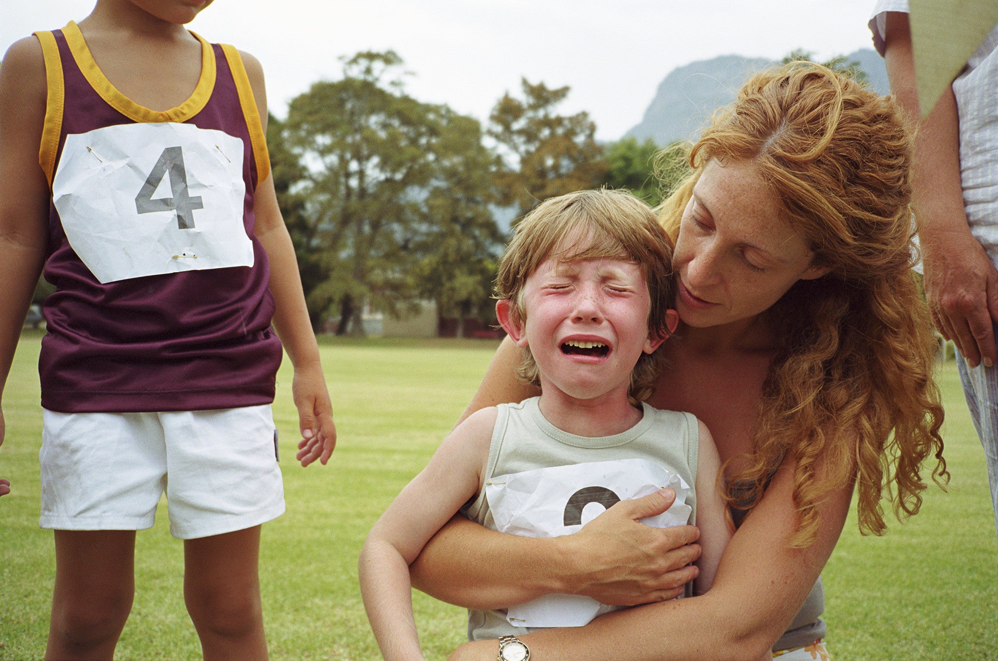 Mum comforting her son