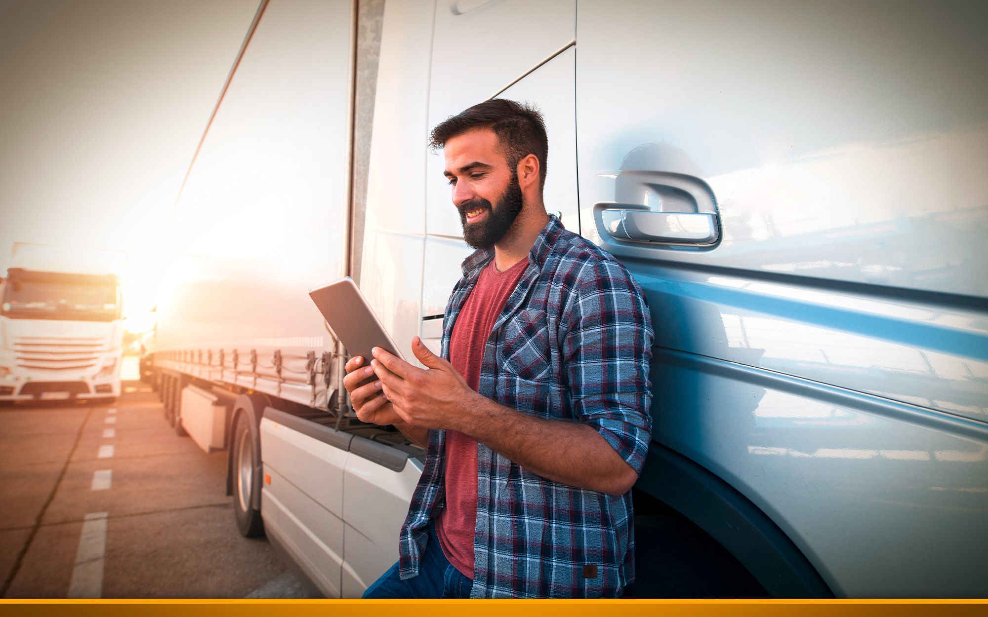 truck driver checking his tablet 