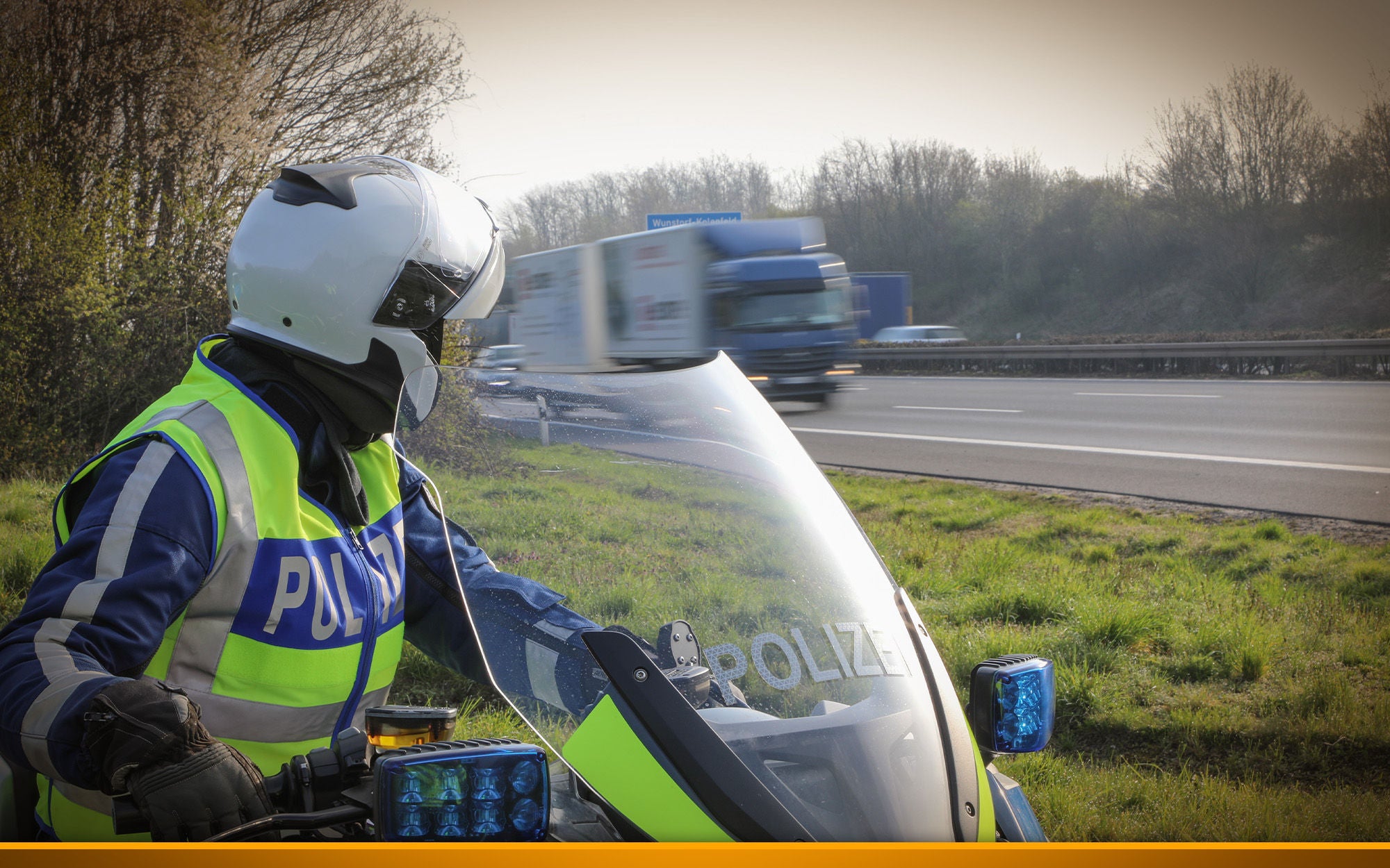 Police watching a truck on a Highway