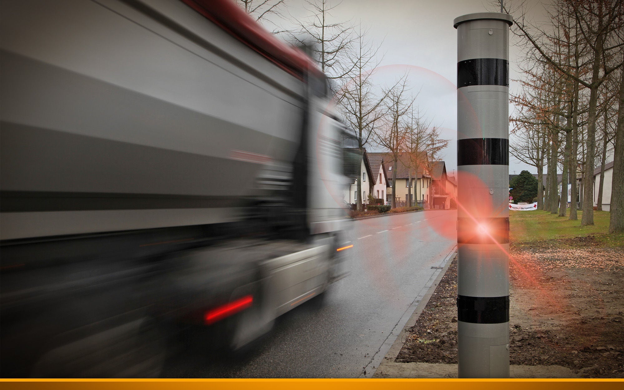 truck drivin next to a speed camera