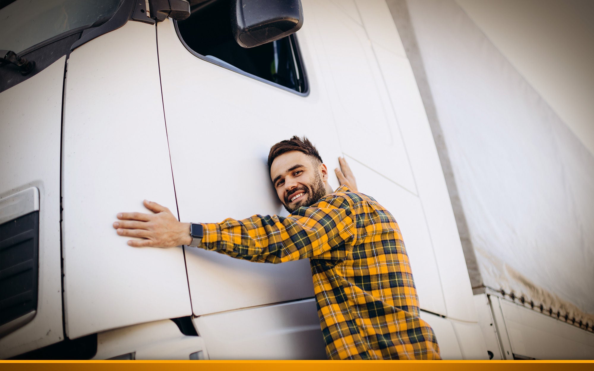 Man trucker hugging his truck