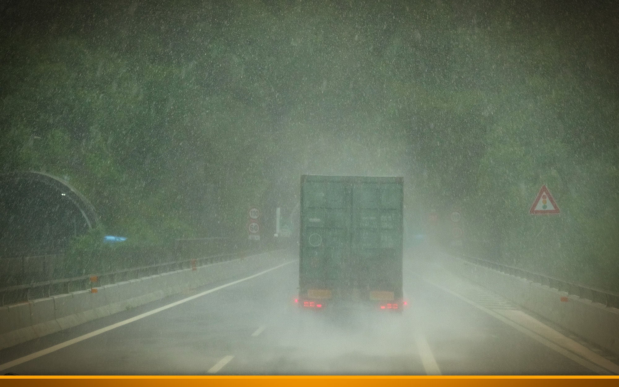  Truck on a highway during heavy rain