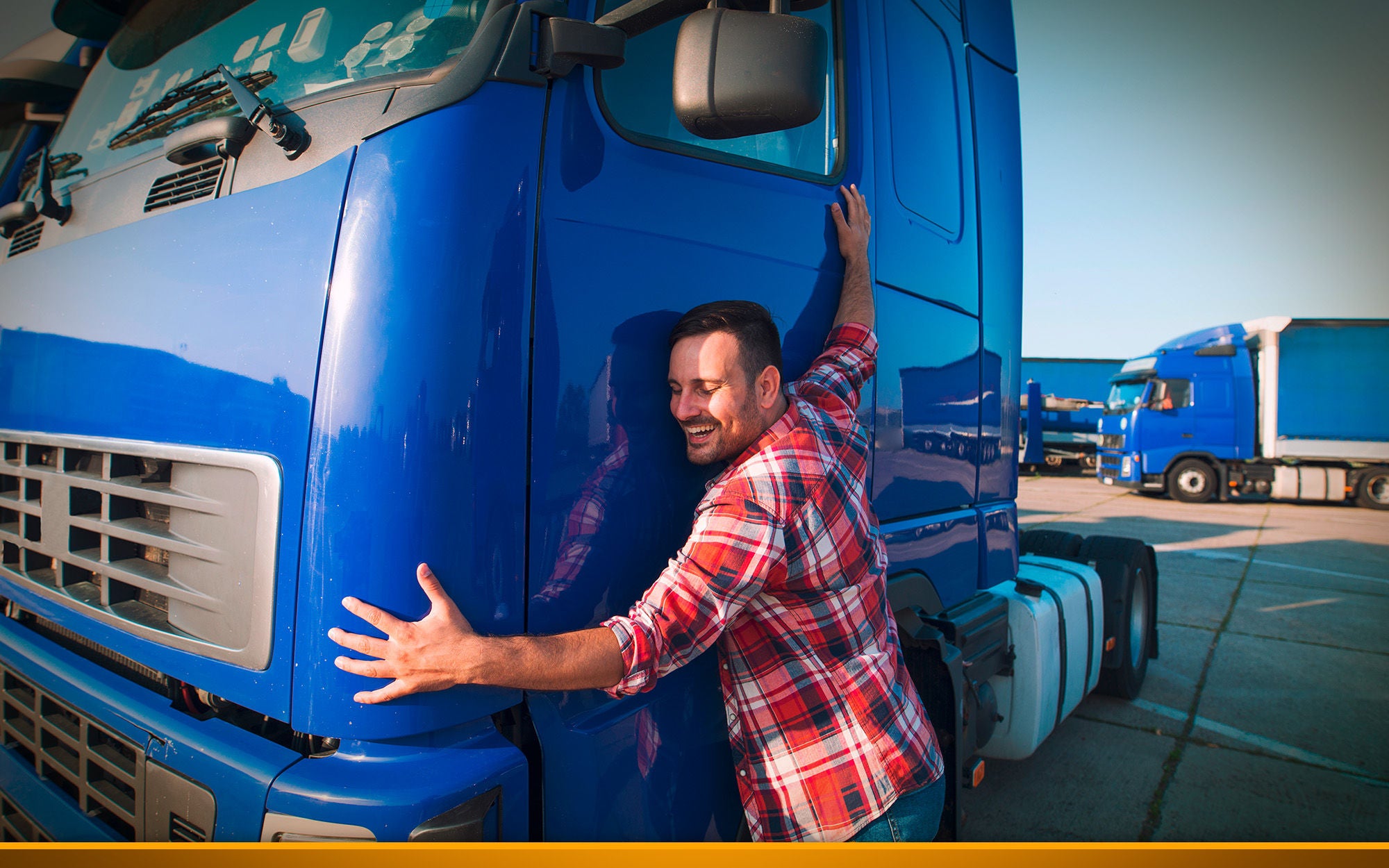 Professional trucker driver hugging his truck