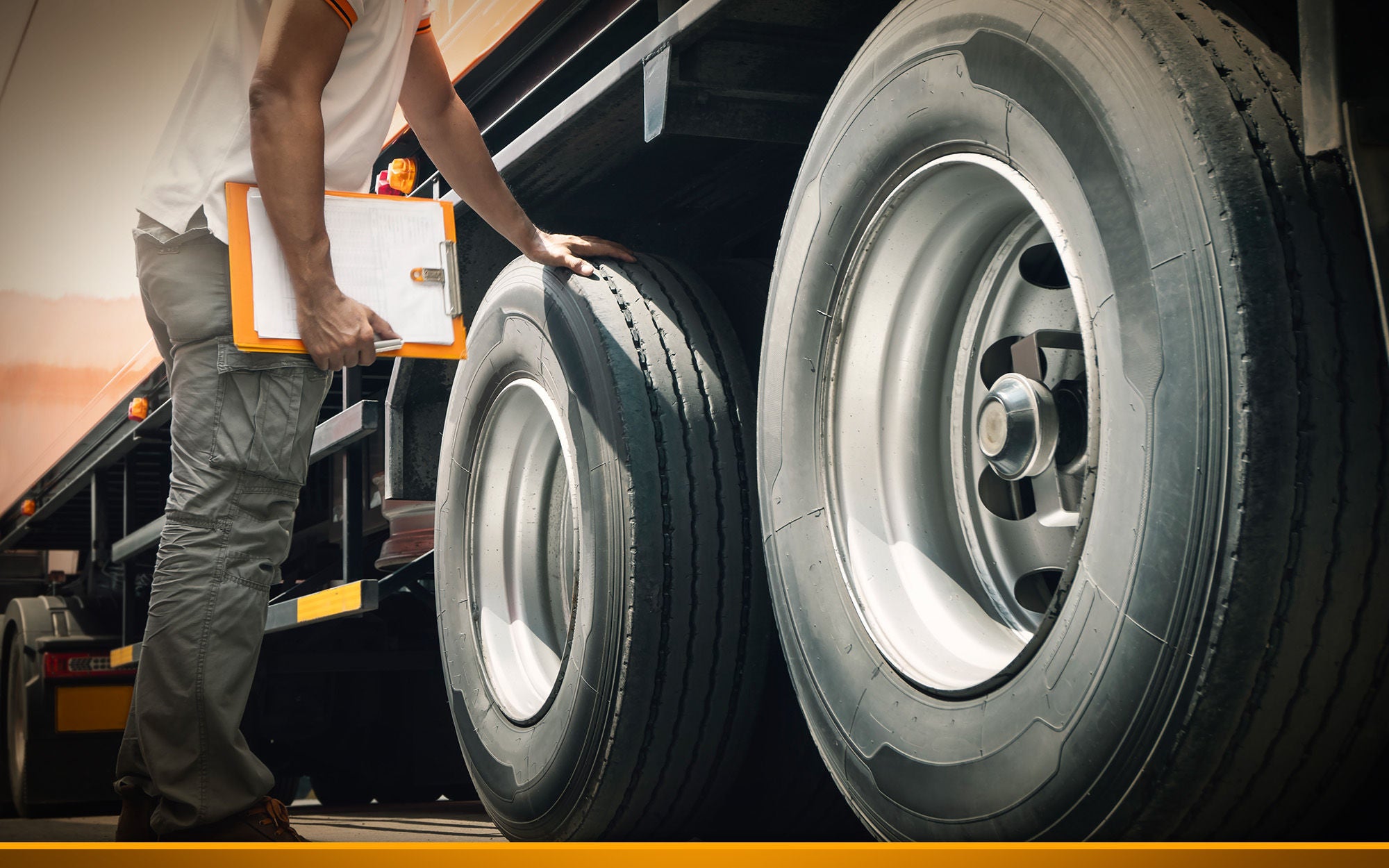 Truck driver is checking the truck's safety of wheels and tires inspection trucks maintenance