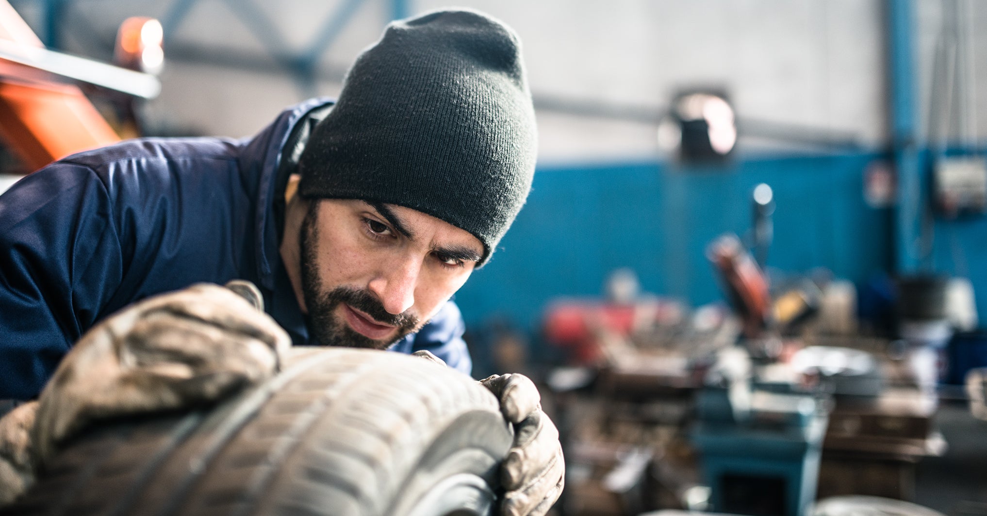 tire repairer checking the tire integrity