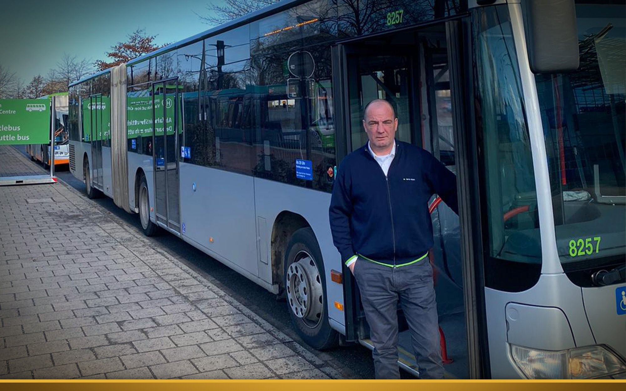 bus driver in front of bus