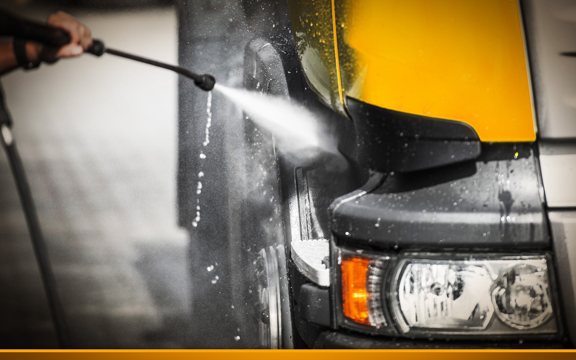 truck gets a wash with a jet of water