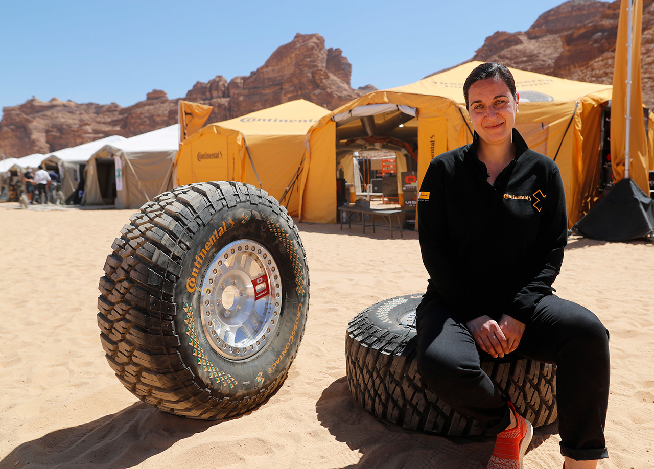 Catarina Silva sitting with Continental Extreme E race tires at the first race location: AlUla, Saudi Arabia