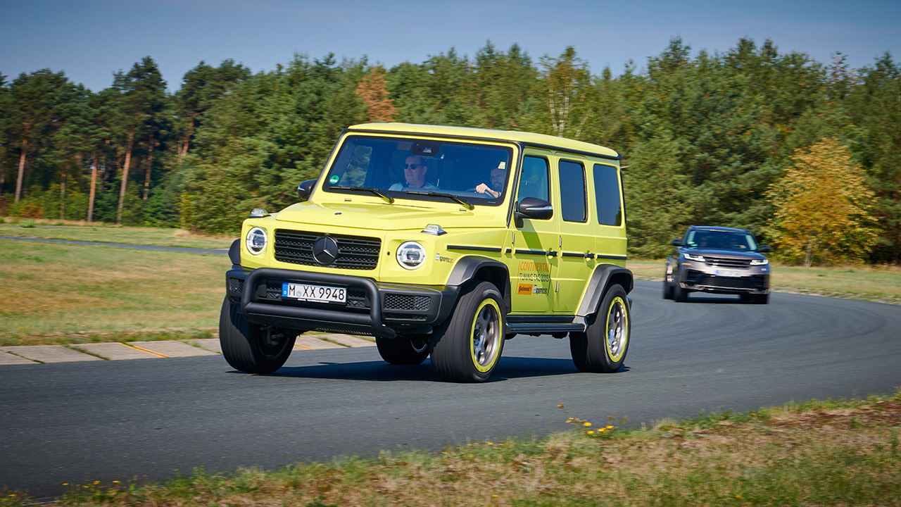 SUV driving a curve on a speed course.