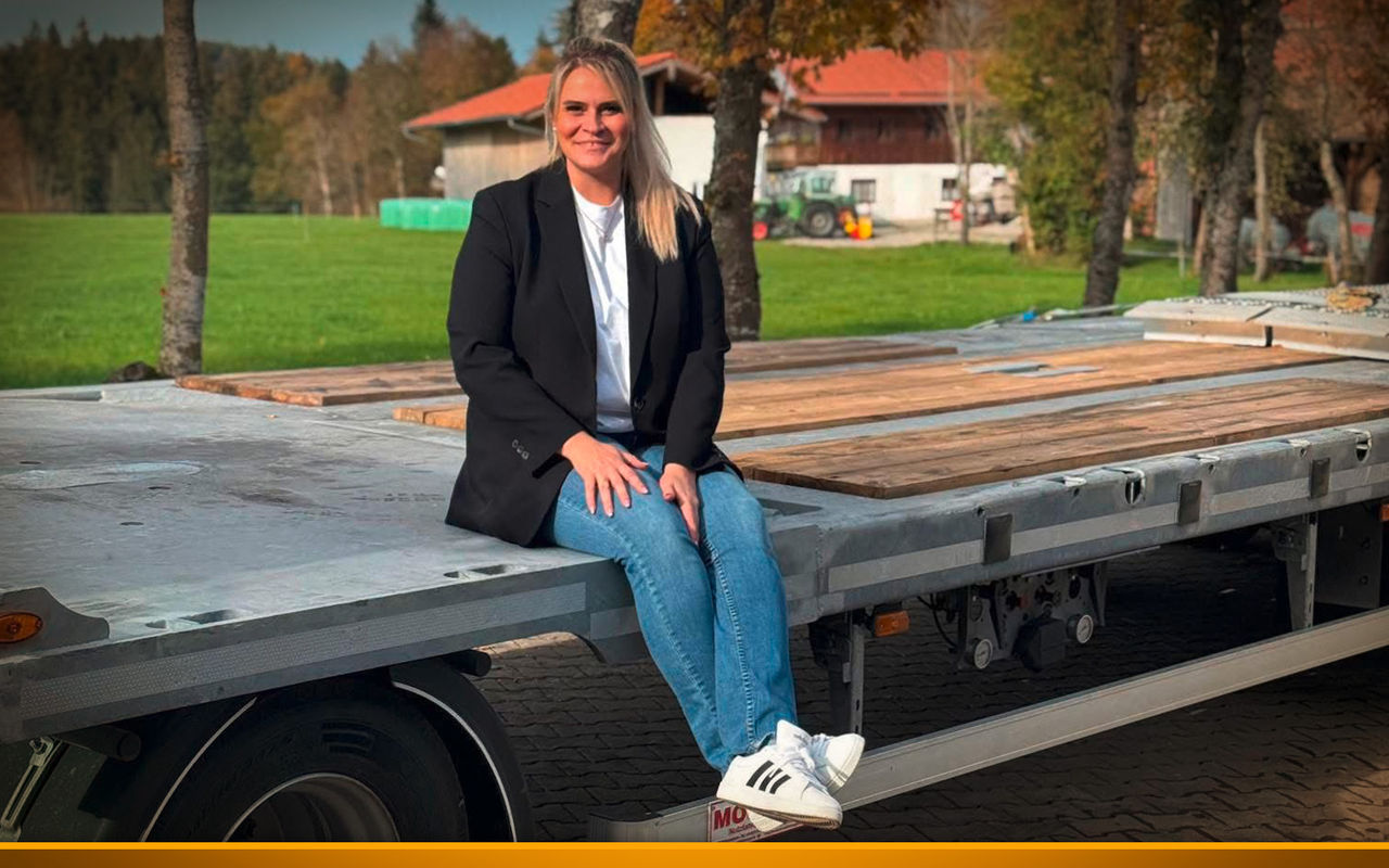 female truck driver on her truck