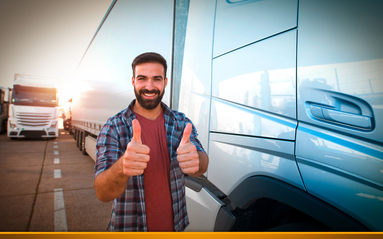Happy young truck driver