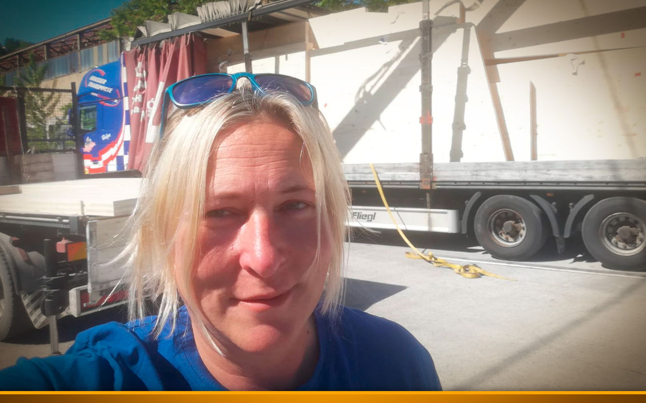woman in front of truck