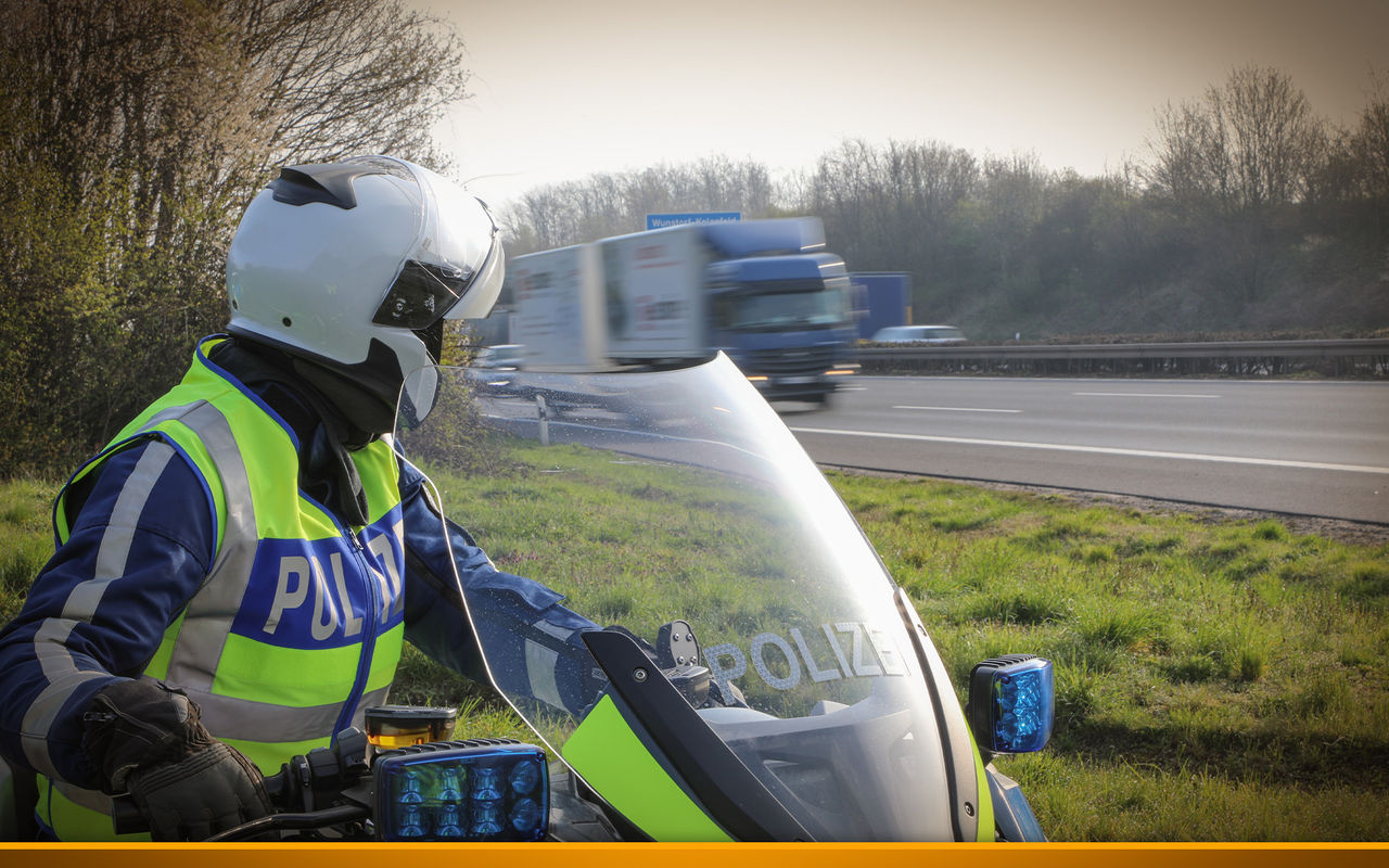 Police watching a truck on a Highway