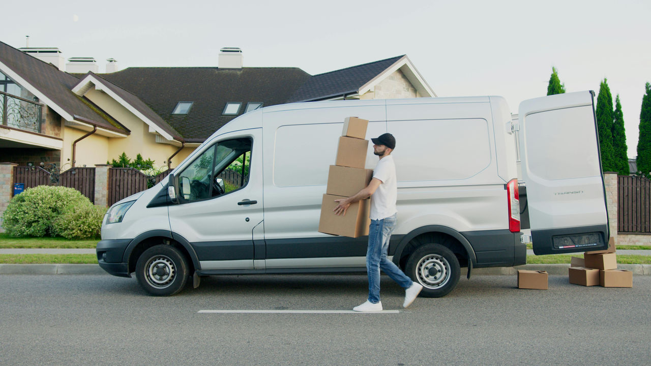 Reinforced3 Man unloading boxes from a van